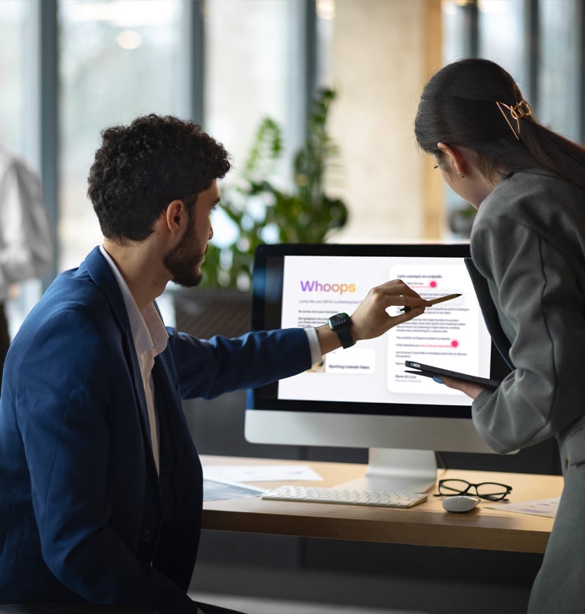 Two managers using computer to access enterprise cybersecurity solutions by Jericho.