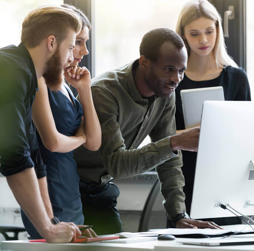 Employees at small tech startup training on cybersecurity for tech companies